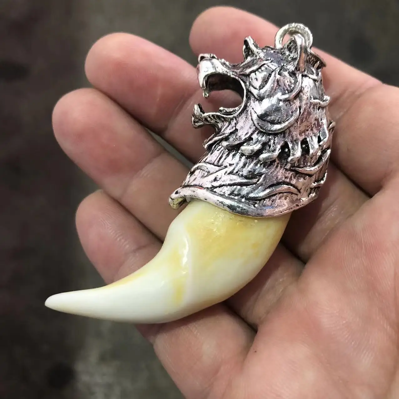 

Antique silver inlaid wild boar tooth pendant