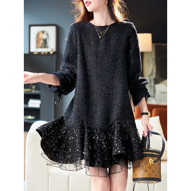 Woman wearing a black mesh sequin splicing dress with slim silk midi skirt in elegant evening style 04
