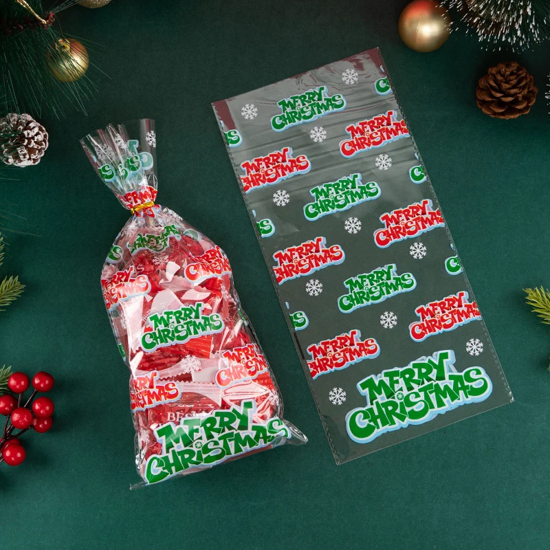 50 Sacchetti Regalo Natalizi Trasparenti In OPP Con Tema Babbo Natale - 27x13 Cm - Con Laccetti Dorati
