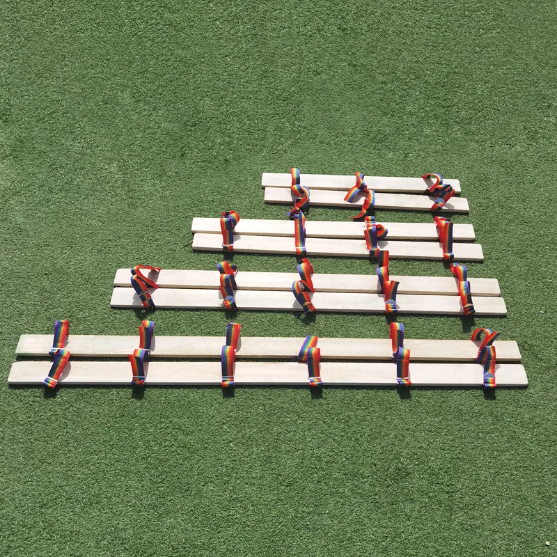 Fun sports event props working together in the same boat working together wooden board shoes racing walking game