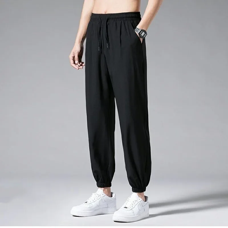 Ice Shreds Casual Pants Men 2024 Summer Thin Style Quick Drying Motion Solid Color Loose Bound Feet Nine Points Casual Trousers
