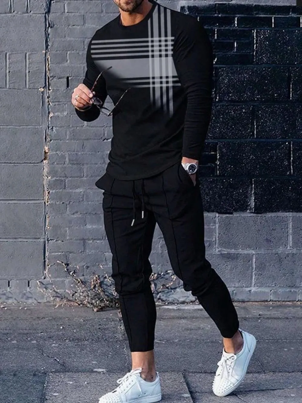 Man wearing striped patchwork long sleeve top and pants set in a sunny outdoor setting black