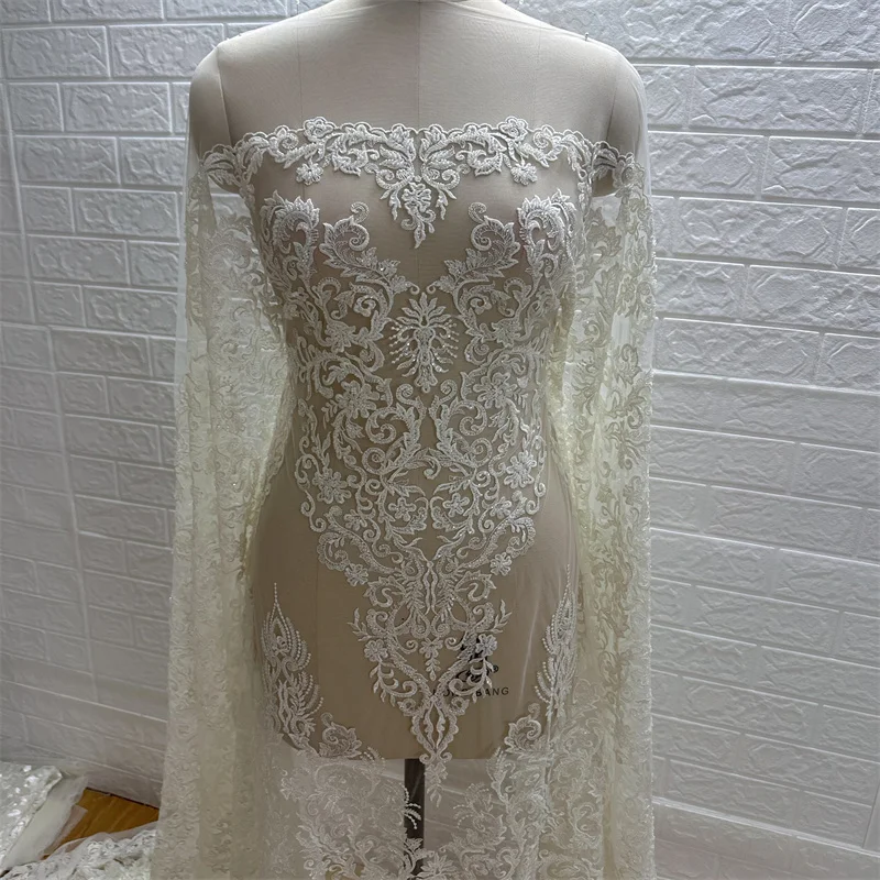 

Вышитый тюль высокого качества по низкой цене с тяжелыми бусинами и блестками цвета слоновой кости одежда для невесты свадебное платье кружевная ткань 1 ярд