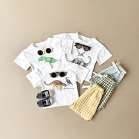 Nouveau bébé vêtements ensemble infantile dinosaure imprimé haut + grille Shorts bébé garçons filles décontracté bébé ensemble nouveau-né été bébé vêtements 2 pièces/ensembles 1