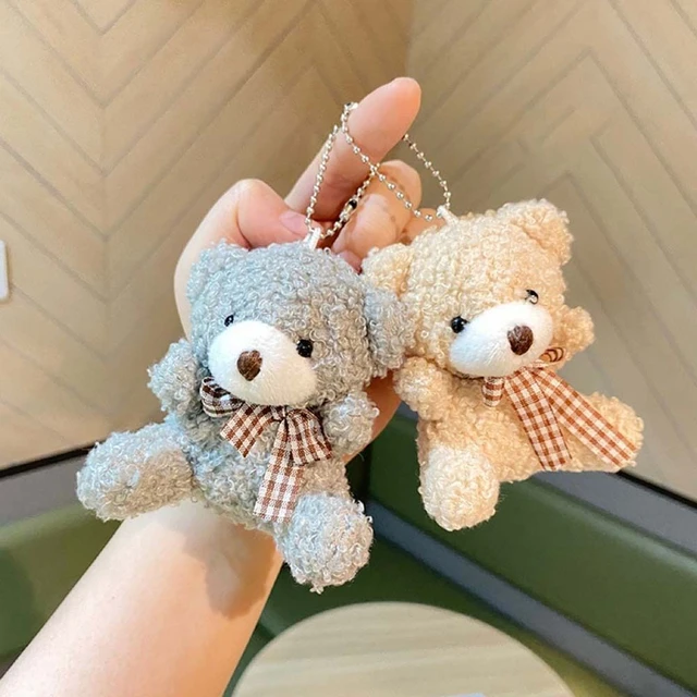 Hand Made Key Ring Brown Teddy Bear Knitted Doll Wearing a Red and White  Shirt and Blue Plant Stock Photo - Image of pattern, teddy: 256501900