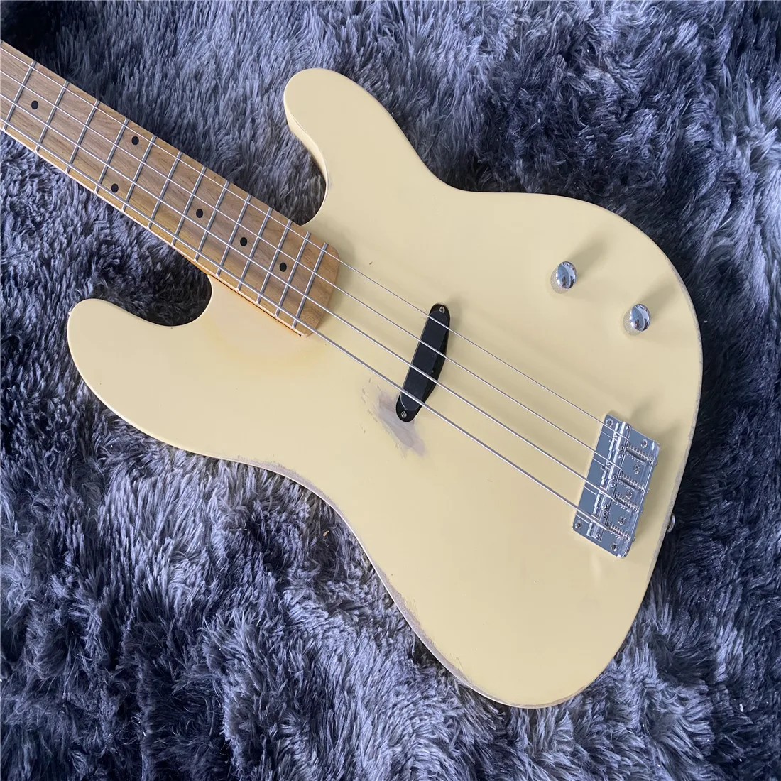 

Vintage four string electric bass, cream colored with old chrome plated hardware maple fingerboard, free shipping