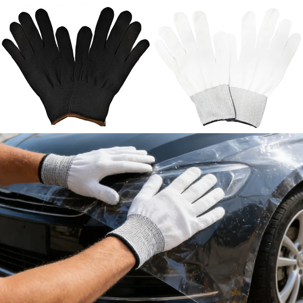 Gants en nylon noirs taille unique, doux et respirants, posés à plat sur fond blanc.