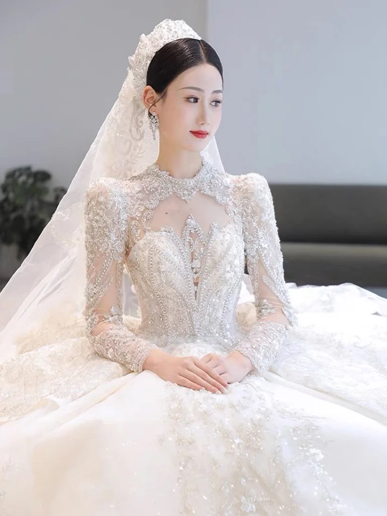 

White Wedding Dresses Long Sleeves Backless High Collar Lace Up Sequined Crystal With Bow Beading Illusion Princess Bridal Gowns