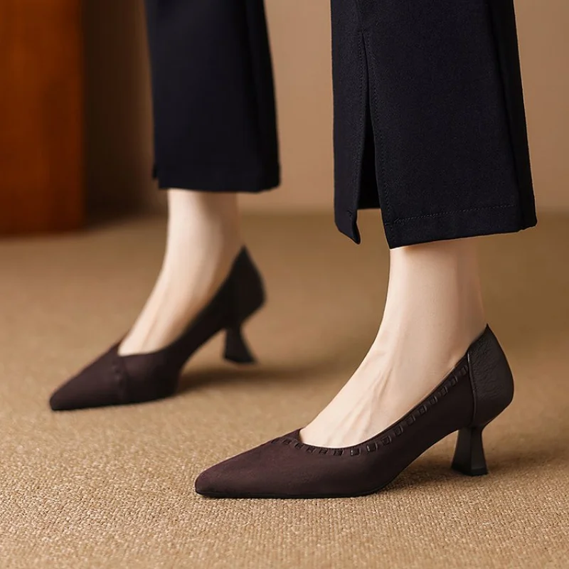 Dark Brown Pointed Toe Kitten Heel Pumps Dark brown pointed toe kitten heel pumps worn with black trousers on beige carpet