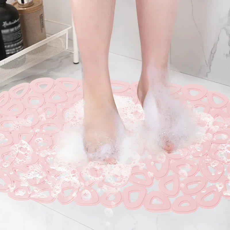 Teal bathroom massage mat with suction cups, quick-drain elliptical holes, and non-slip waterproof surface.