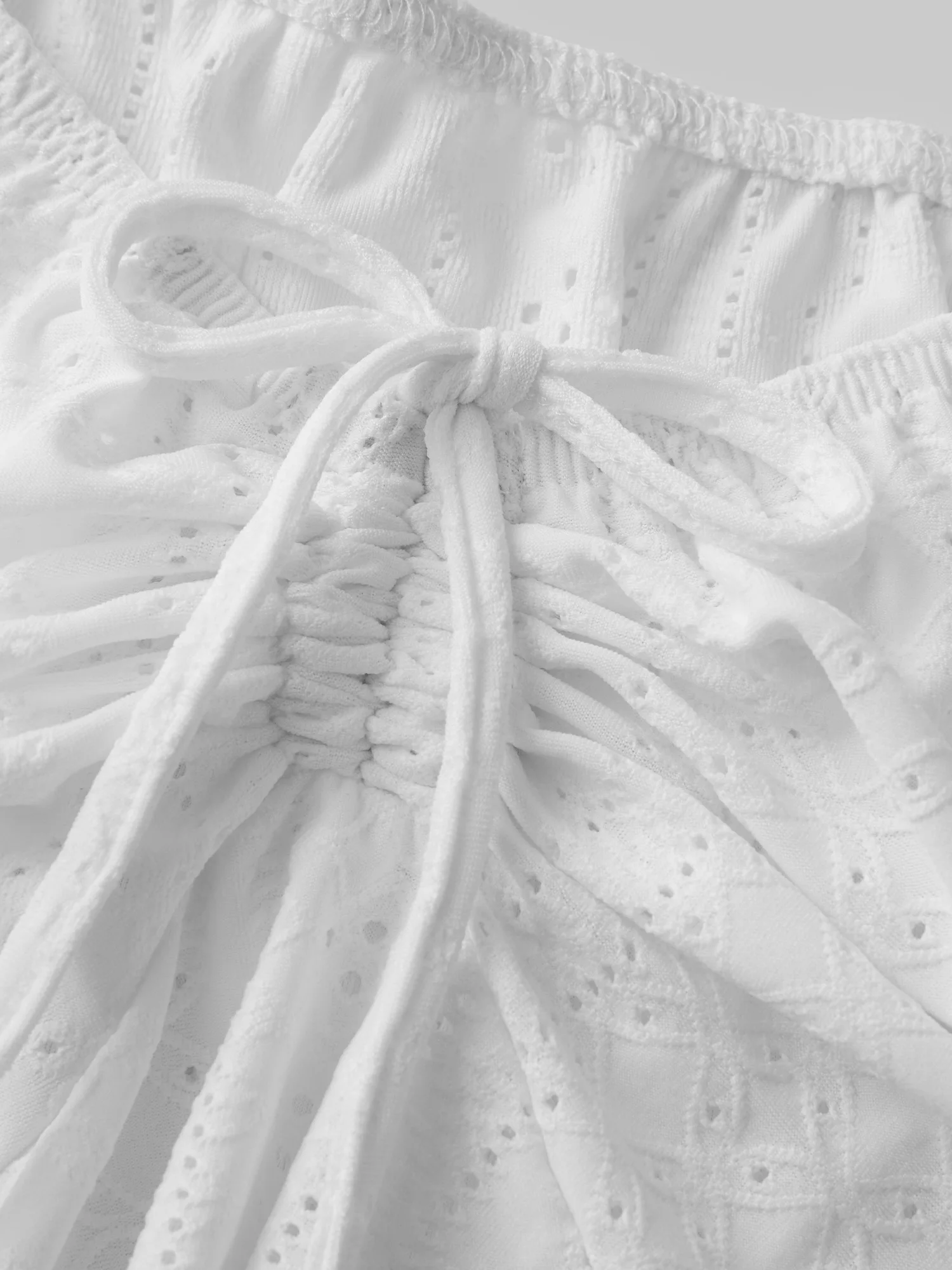 Stylish Women s Off Shoulder Blouse with Short Puff Sleeves and Tie Up Detail Featuring Irregular Hem and Eyelet Design in