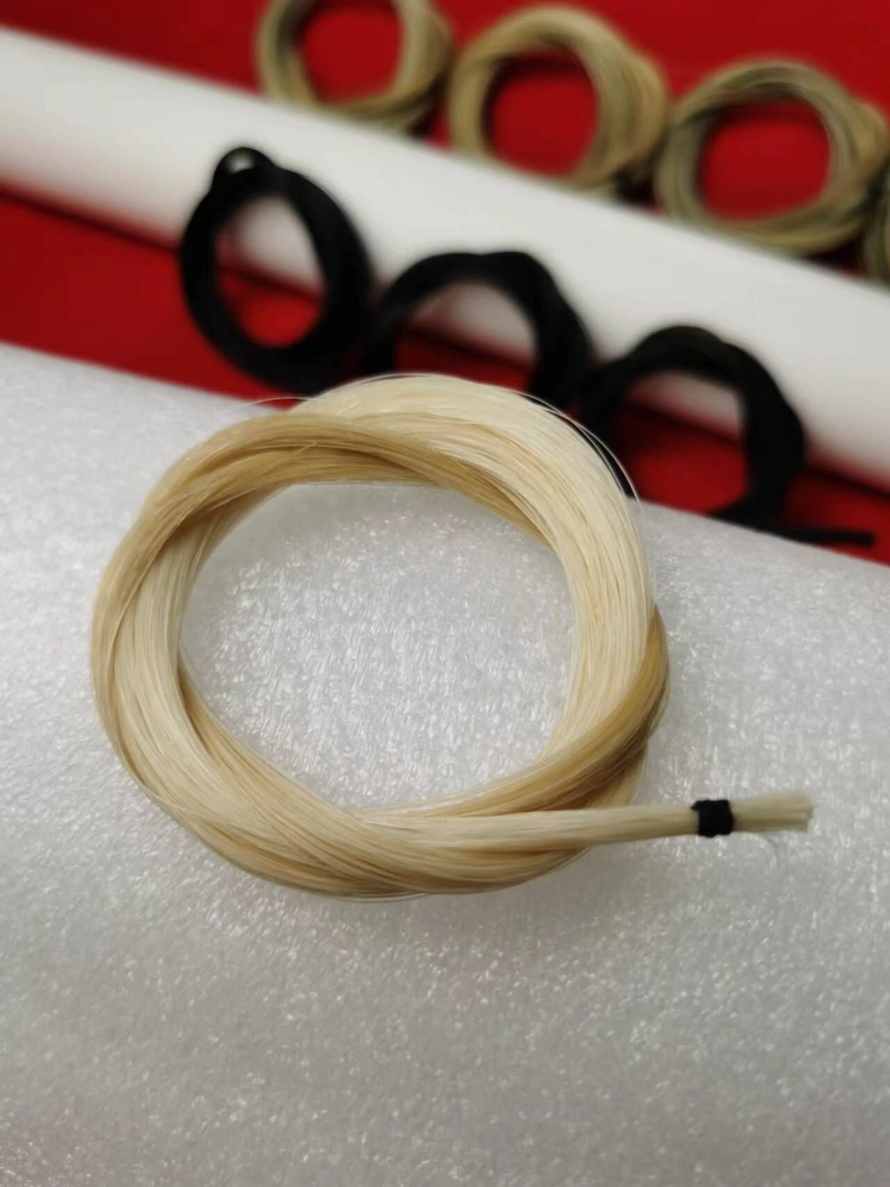 A bunch of white violin bow hair White horsetail bow hair Horse hair