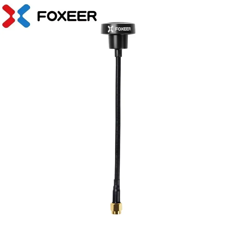 Antenne FOXEER Pagode Pro 5.8GHz 3dBi RHCP posée sur une surface, vue de côté montrant sa forme compacte.