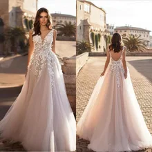 

2022 Deep V Neck Beach Wedding Dress Sexy Backless 3D Floral Lace Appliqued Lace Bridal Gowns Sweep Train Tulle Vestido De Noiva