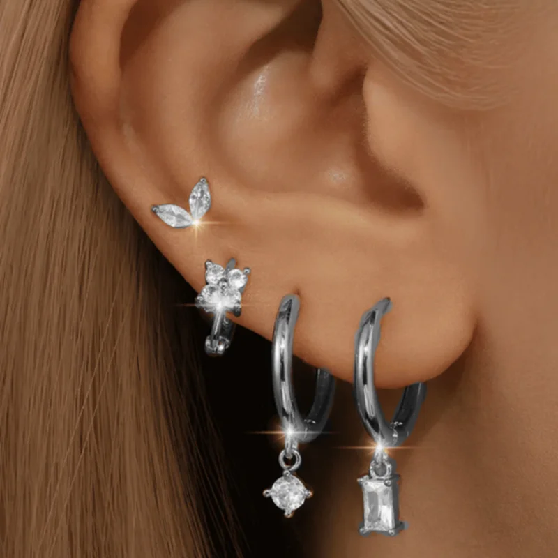 Women’s green huggie hoop earrings styled