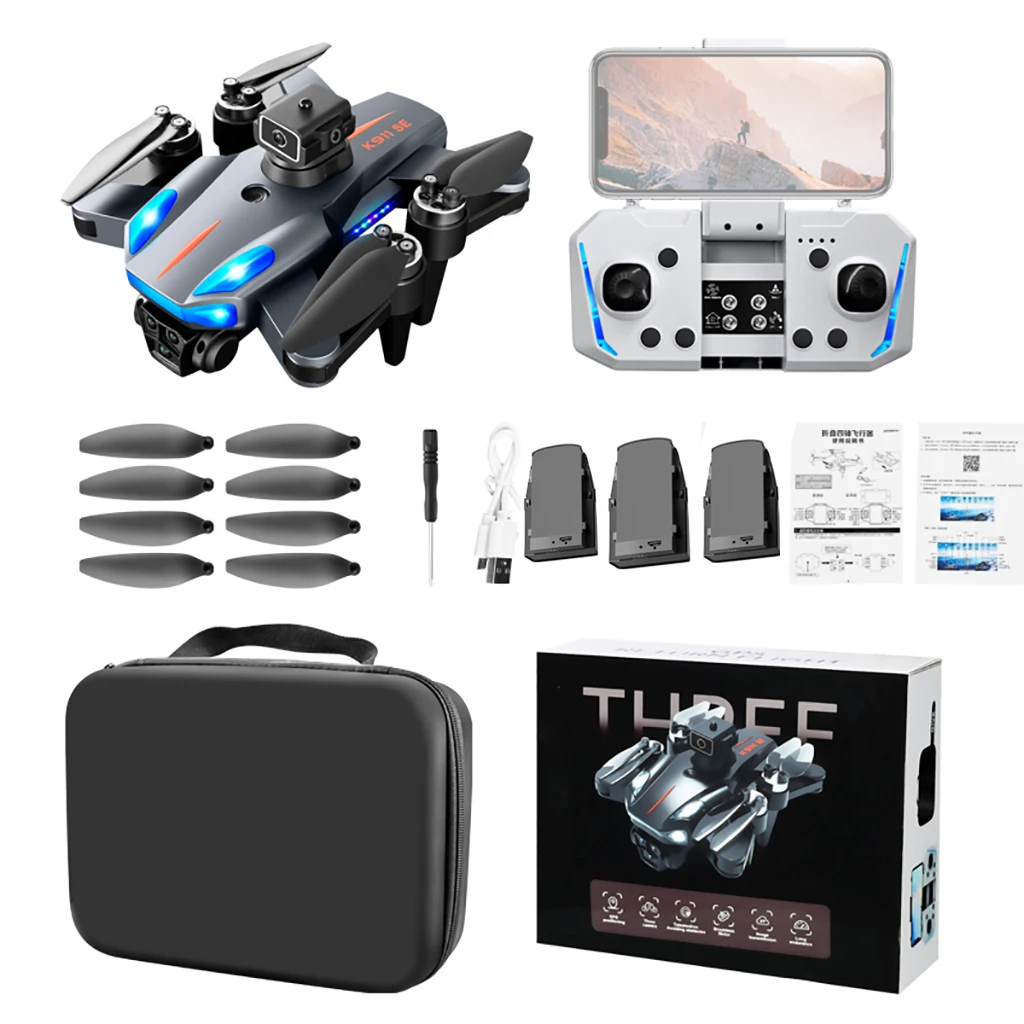 Drone K911SE GPS 4K Caméra FPV en vol de nuit, avec ses lumières LED visibles et le paysage urbain illuminé en arrière-plan.