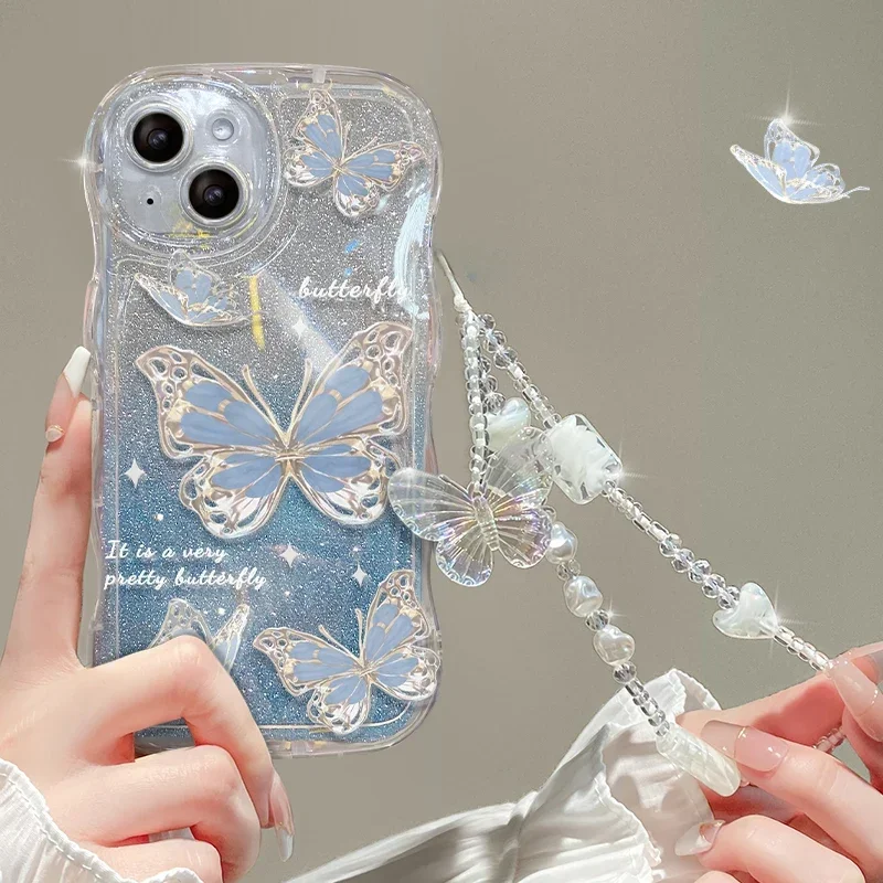 thumbnail image 1 of Funda con cordón degradado de mariposa brillante para iPhone, 14, 13, 15, 16 Pro Max, 12, 11, X, Xr, Xs, 8, 7 Plus, cadena de muñeca de mano, cubierta de onda suave, 1 of 5