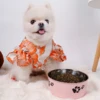 A pet dog bowl in the shape of a cartoon footprint, made of thickened stainless steel, suitable for indoor and outdoor use