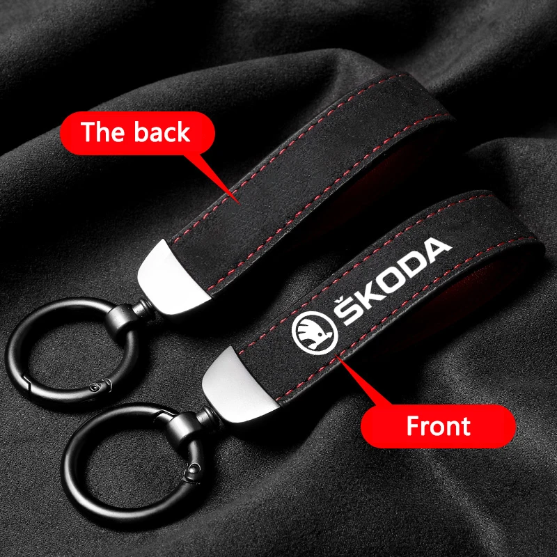 Elegant Metal and Suede Car Keychain with Emblem Design