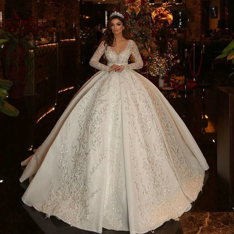 

Saudi Arabic Ball Gown Illusion Back Long Sleeve Wedding Dresses 2023 Princess Sweetheart Glitter Sequined Appliques Bride Gowns
