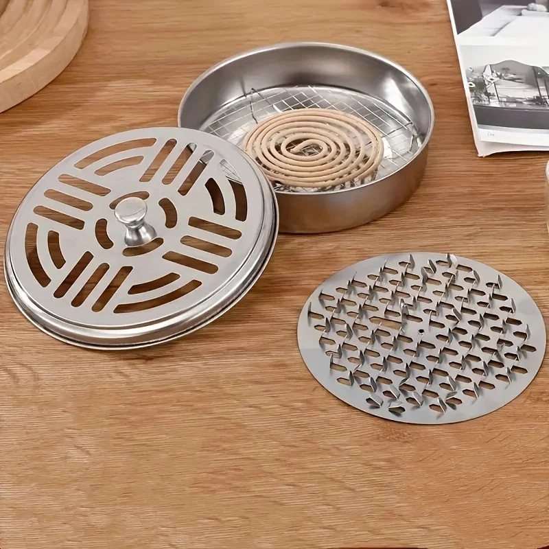 Open windproof lid revealing mosquito coil inside