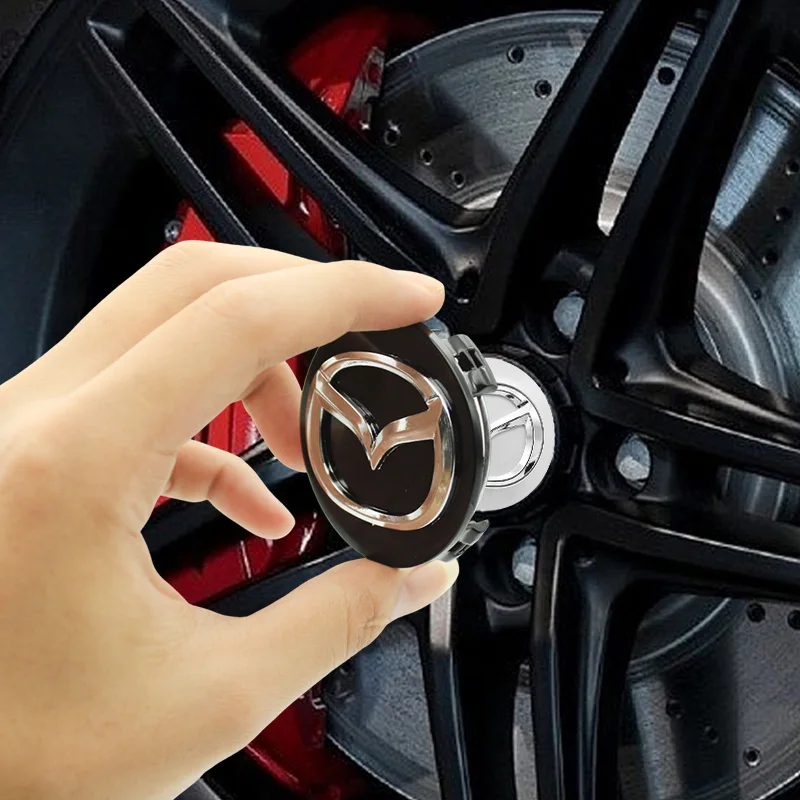 1 TAPPO COPRIMOZZO MAZDA 2 3 6 5 MX5 MPV CX 7 9 RX8 - Foto 10