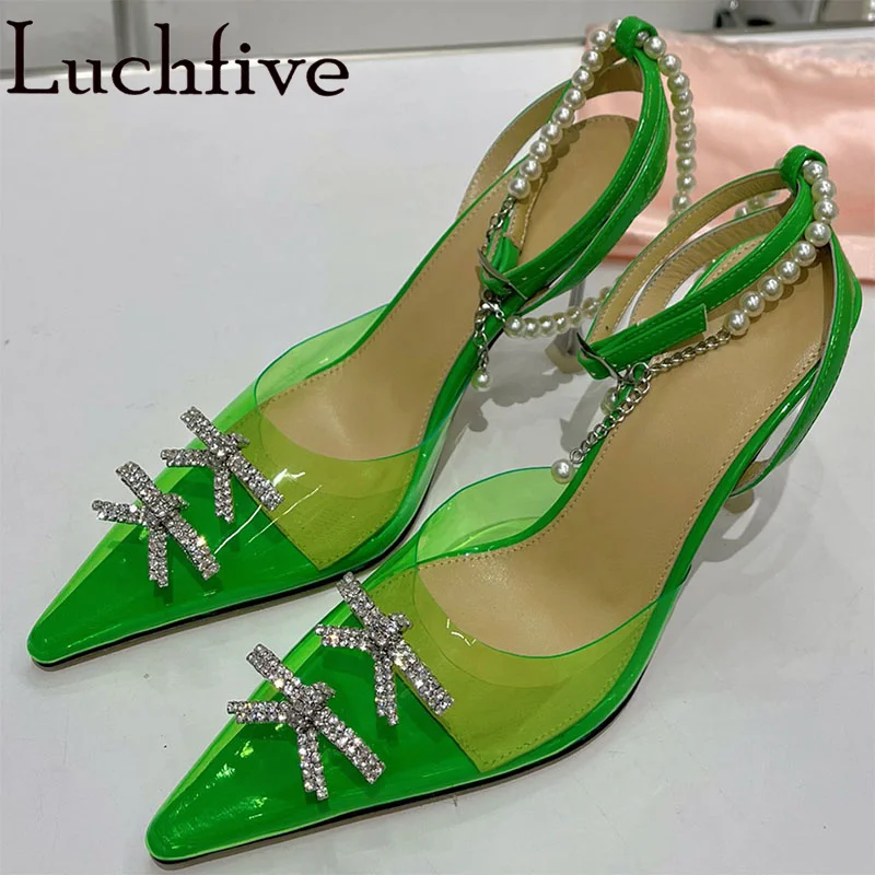 

Sexy Pointed Toe PVC Bowknot Crystal Thin High Heels Sandals For Wome Pearl Buckle Strap Pumps Brand Designer Runway Shoes