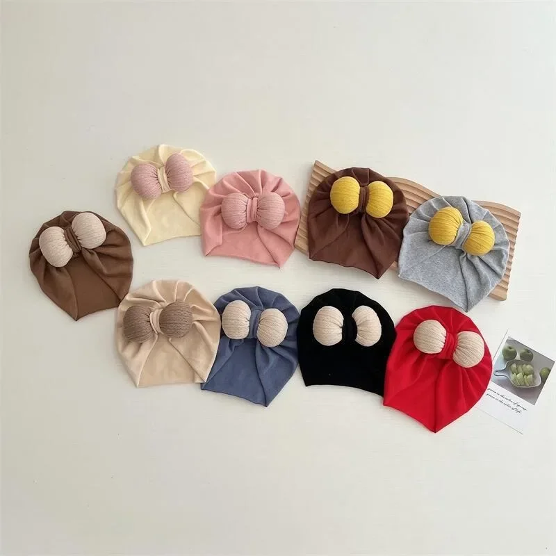

New Cute Baby Foreign Style Solid Color Bow Hairball Cap for Baby Boys and Girls with Concave Shape Tire Cap