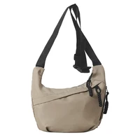 Neutral style tote bag with strap for carrying fitness items. New mini street-style handbag with shoulder strap. Lightweight and 4