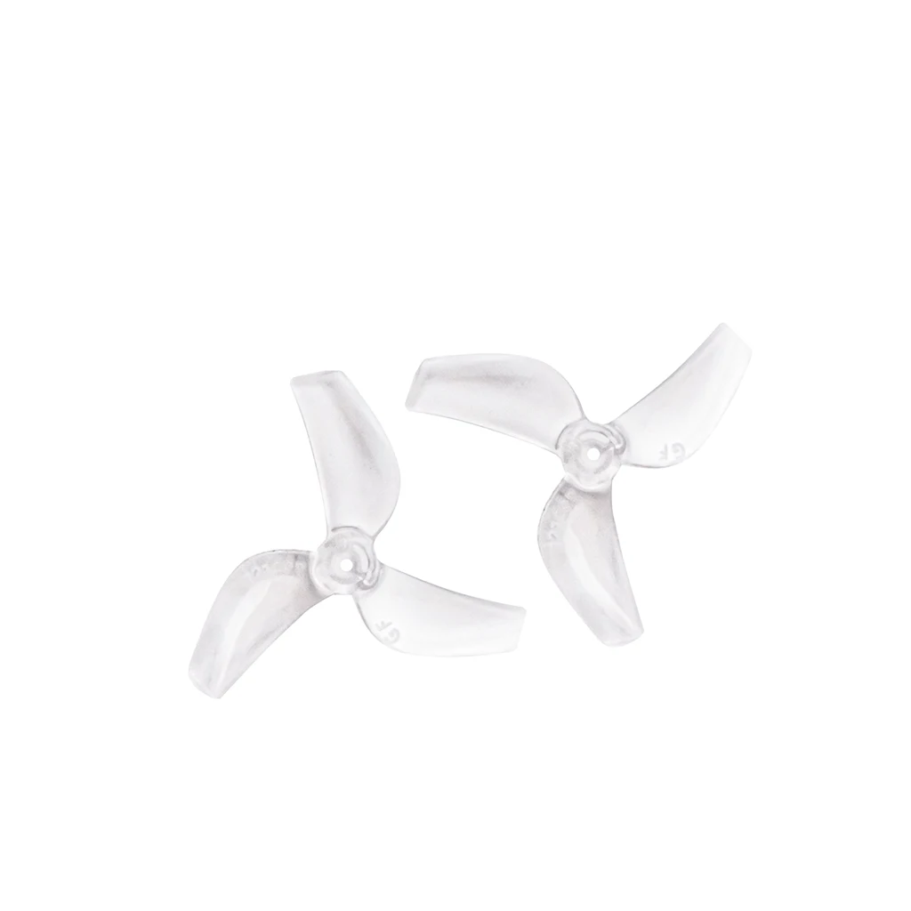 Hélice violette 1mm pour drone FPV micro, à côté d'une pièce de monnaie pour l'échelle.
