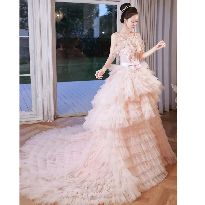 

2023 New Pink Quinceanera Dresses Fashion Spaghetti Straps Prom Dress With Small Train Sweet Bow Feathers Vestido De Debutante