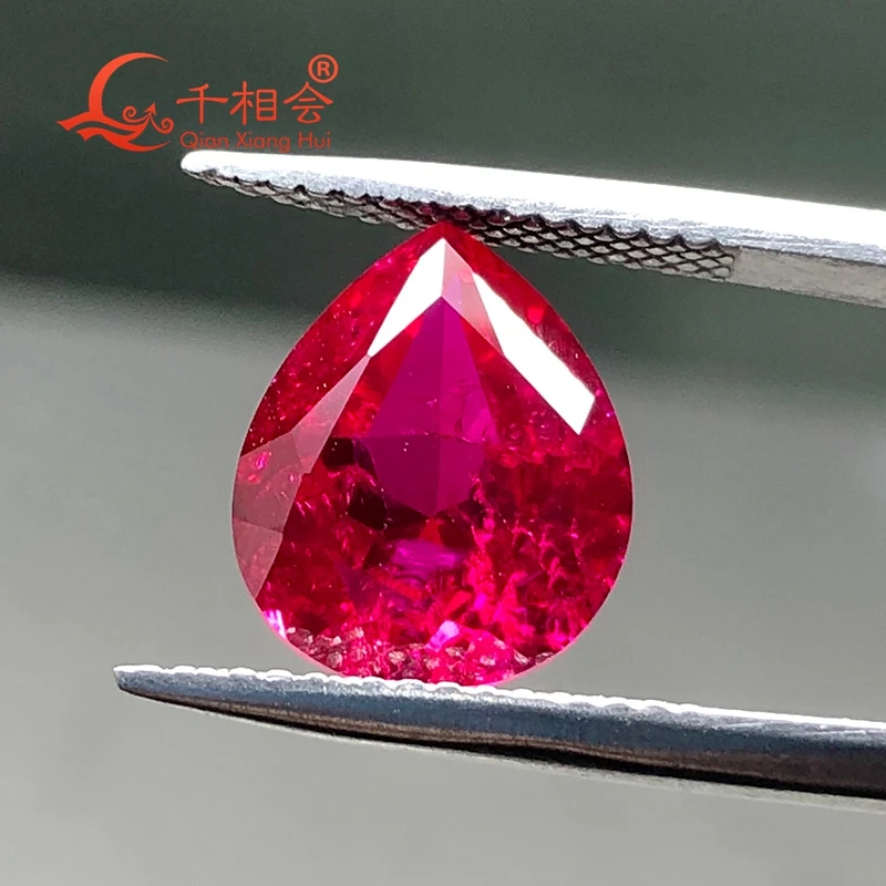 

pear shape natural cut Artificial red lab created ruby including minor cracks and inclusions loose gem stone