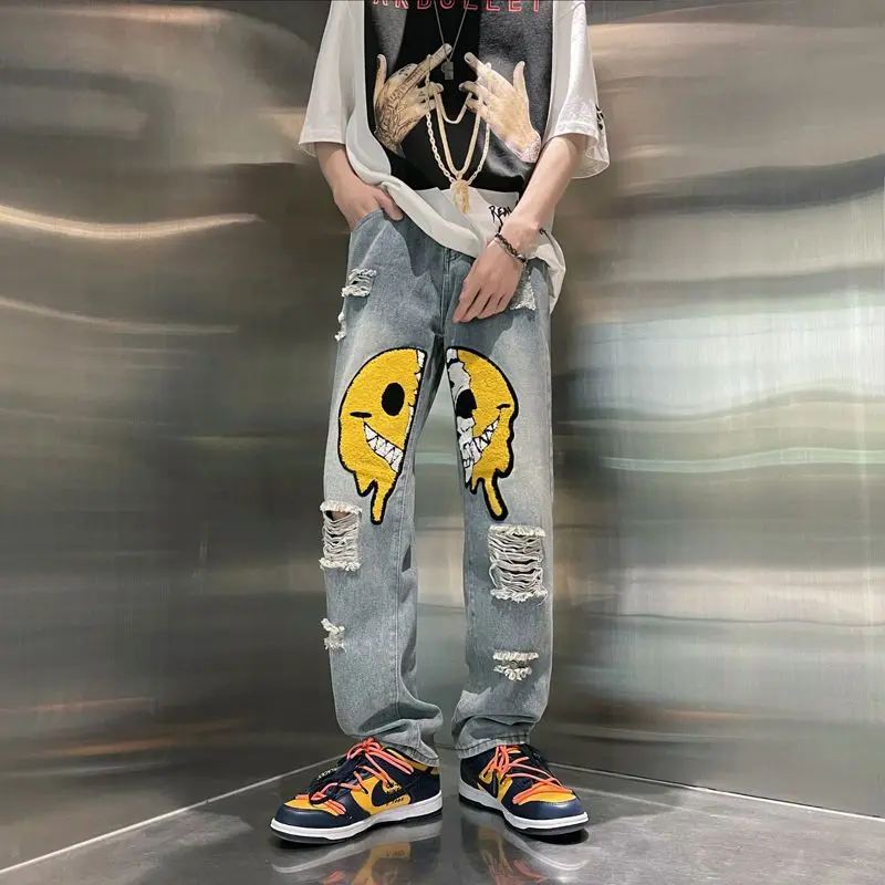 

American style high street style jeans men summer smiling face with holes design sense versatile crowd loose straight mop pants