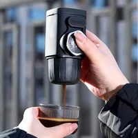 Portable hand-operated coffee machine