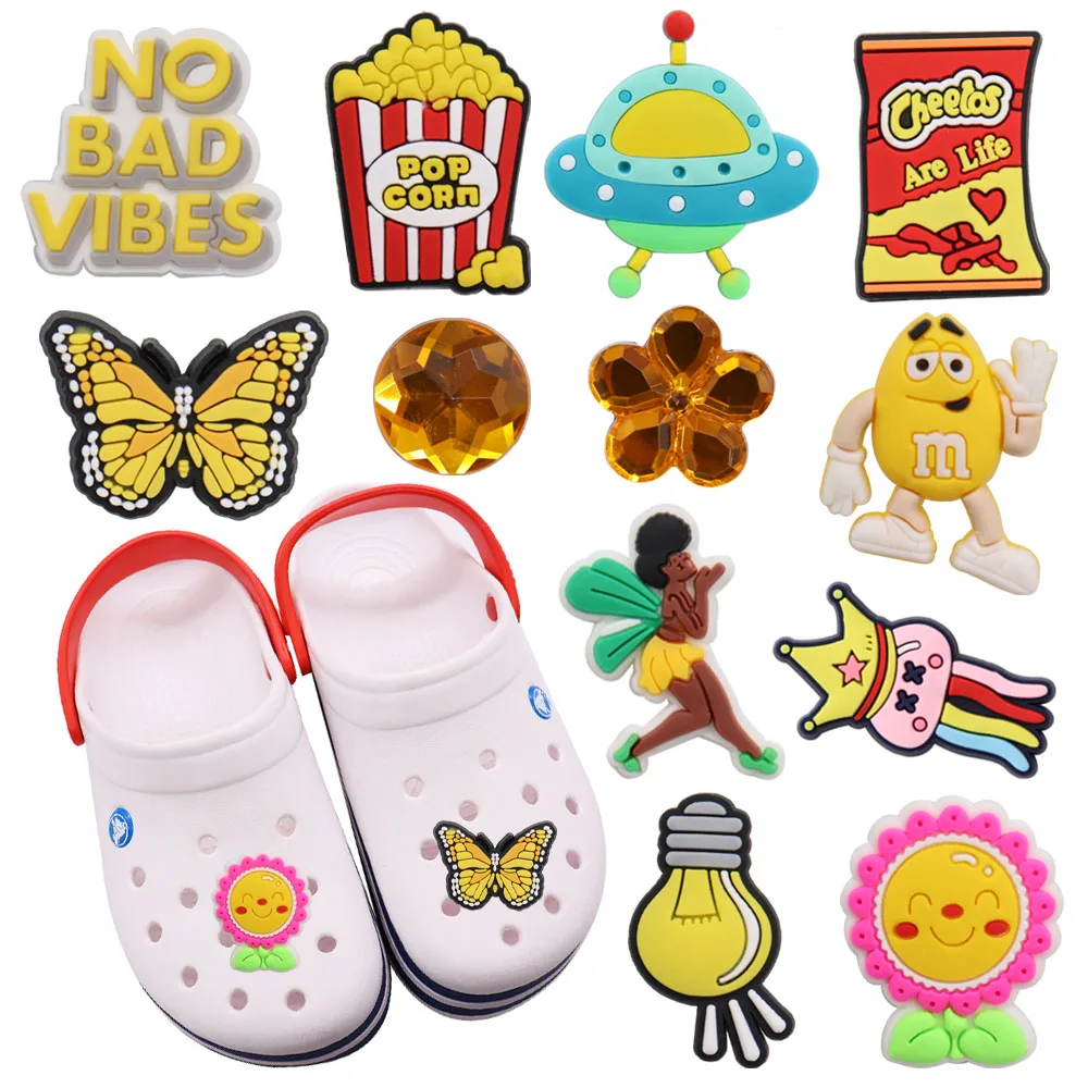 

Mix 50pcs PVC Croc Charms No Bad Vibes UFO Chocolate Alien Sunflower Popcorn Butterfly Light Bulb Garden Shoes Button Decoration