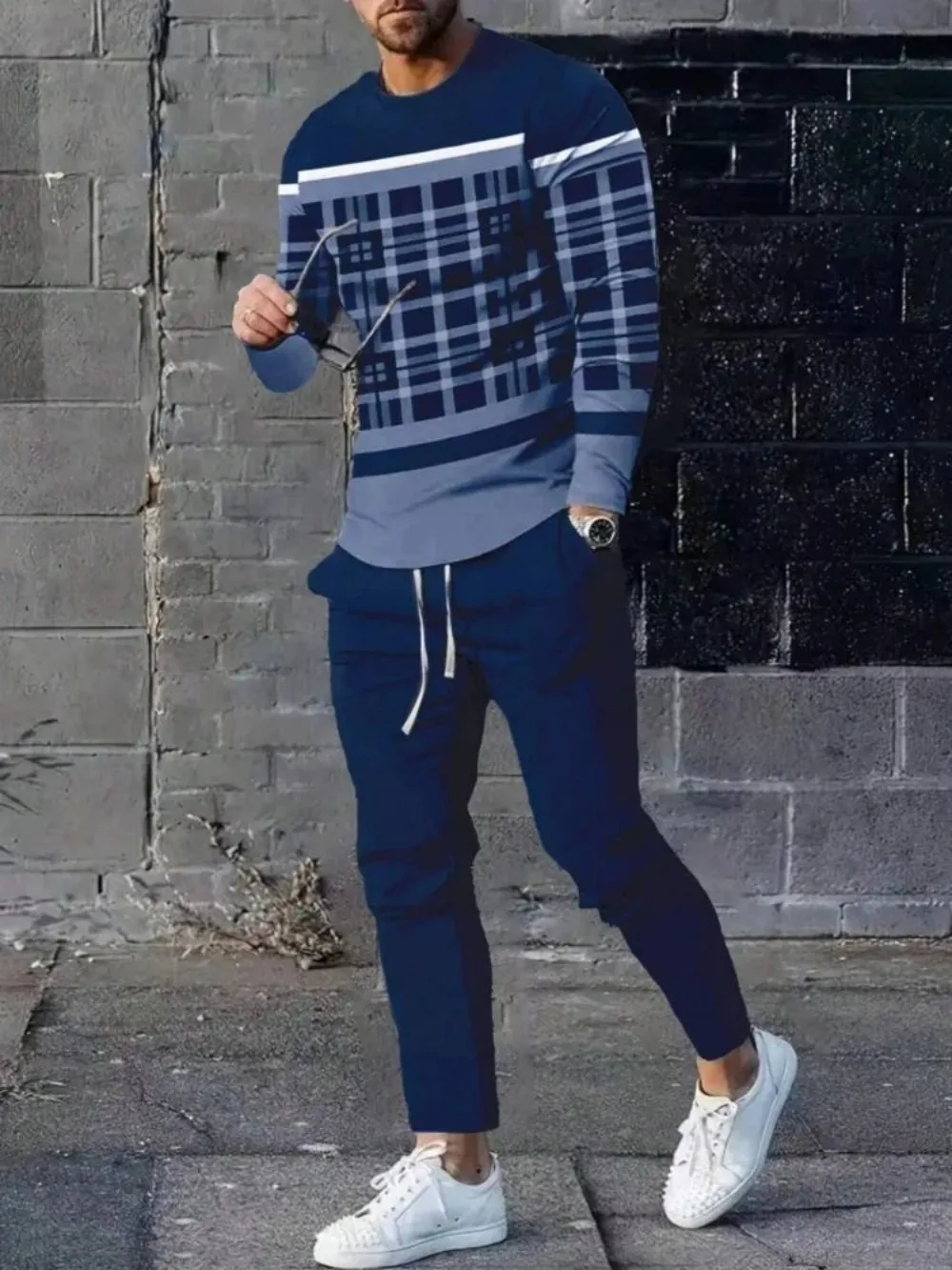 Man wearing striped patchwork long sleeve top and pants set in a sunny outdoor setting blue 02
