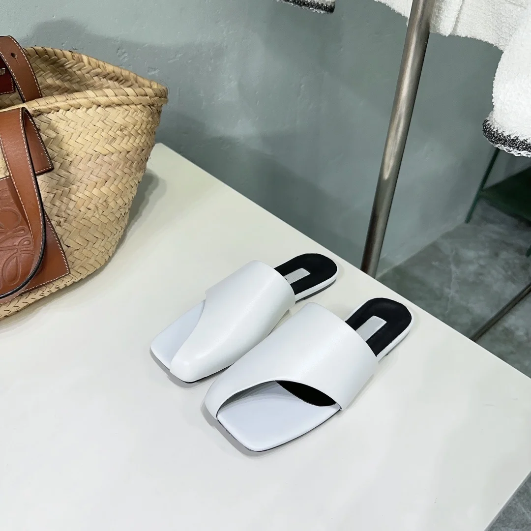 Women's shoes summer new minimalist style leather square head half pack side air fashionable slope heel flat bottom slippers