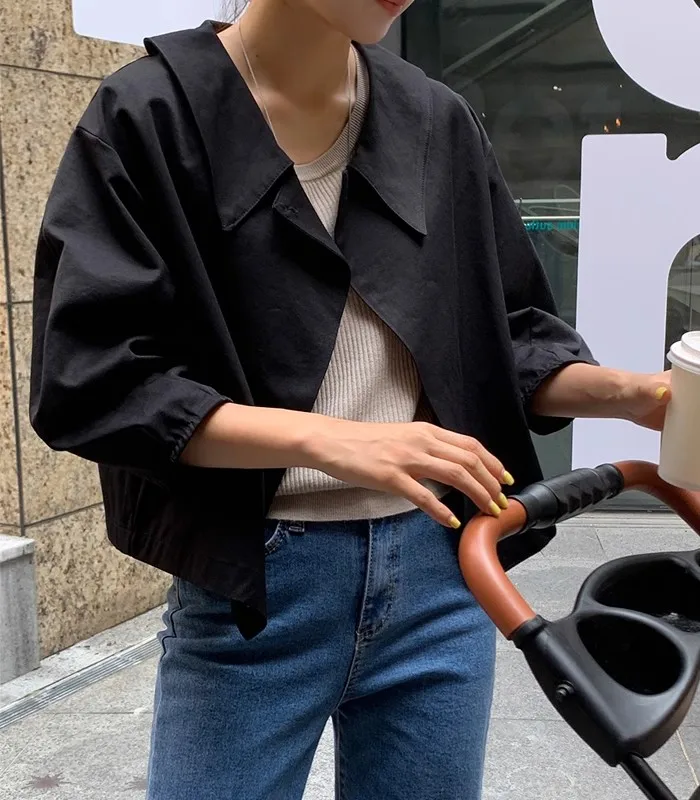 

South Korea chic autumn niche British style lapel loose casual with a solid color long-sleeved cloak style trench coat