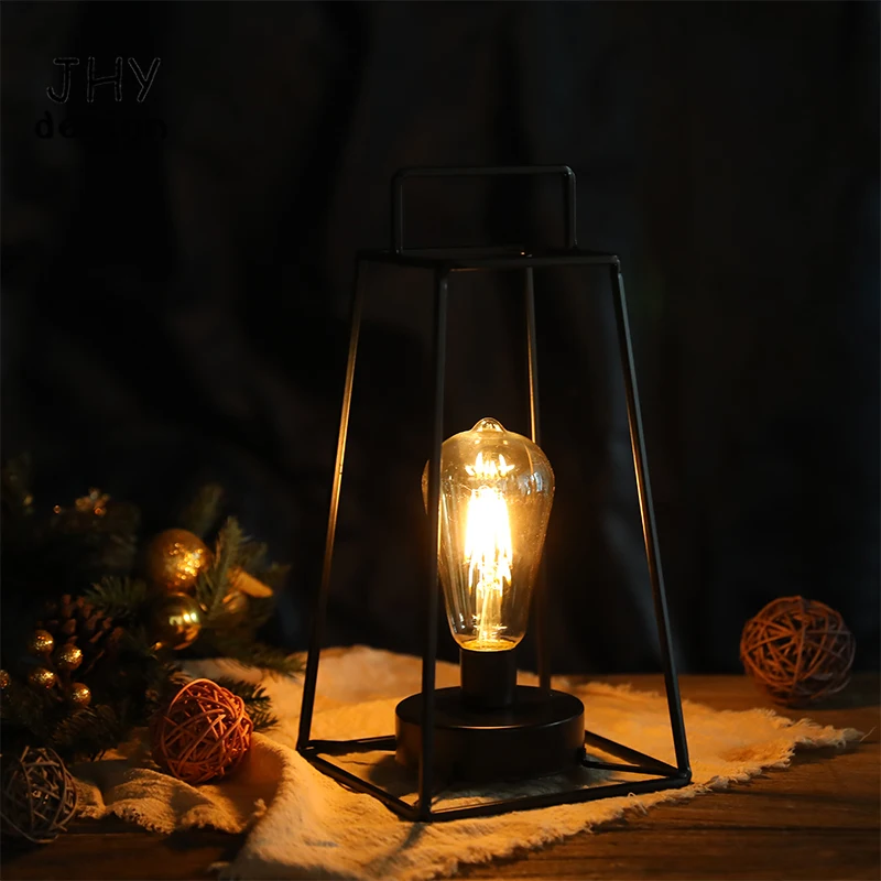 https://ae01.alicdn.com/kf/S90ddfc970e6d43d6b64cee6efda2138dq/Retro-Geometric-Table-Lamp-Black-Simple-Iron-Art-Cordless-Lamp-Battery-Operated-Lamp-Cage-Wireless-Lamp.jpg