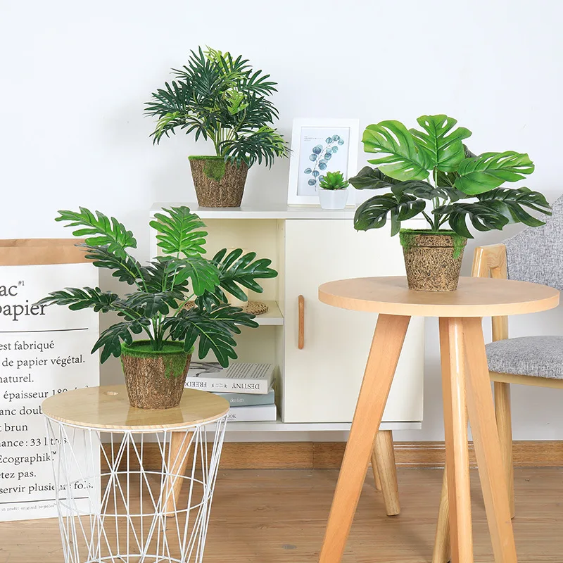 

Small potted simulated plant decoration with green pineapple leaves and turtle back leaves