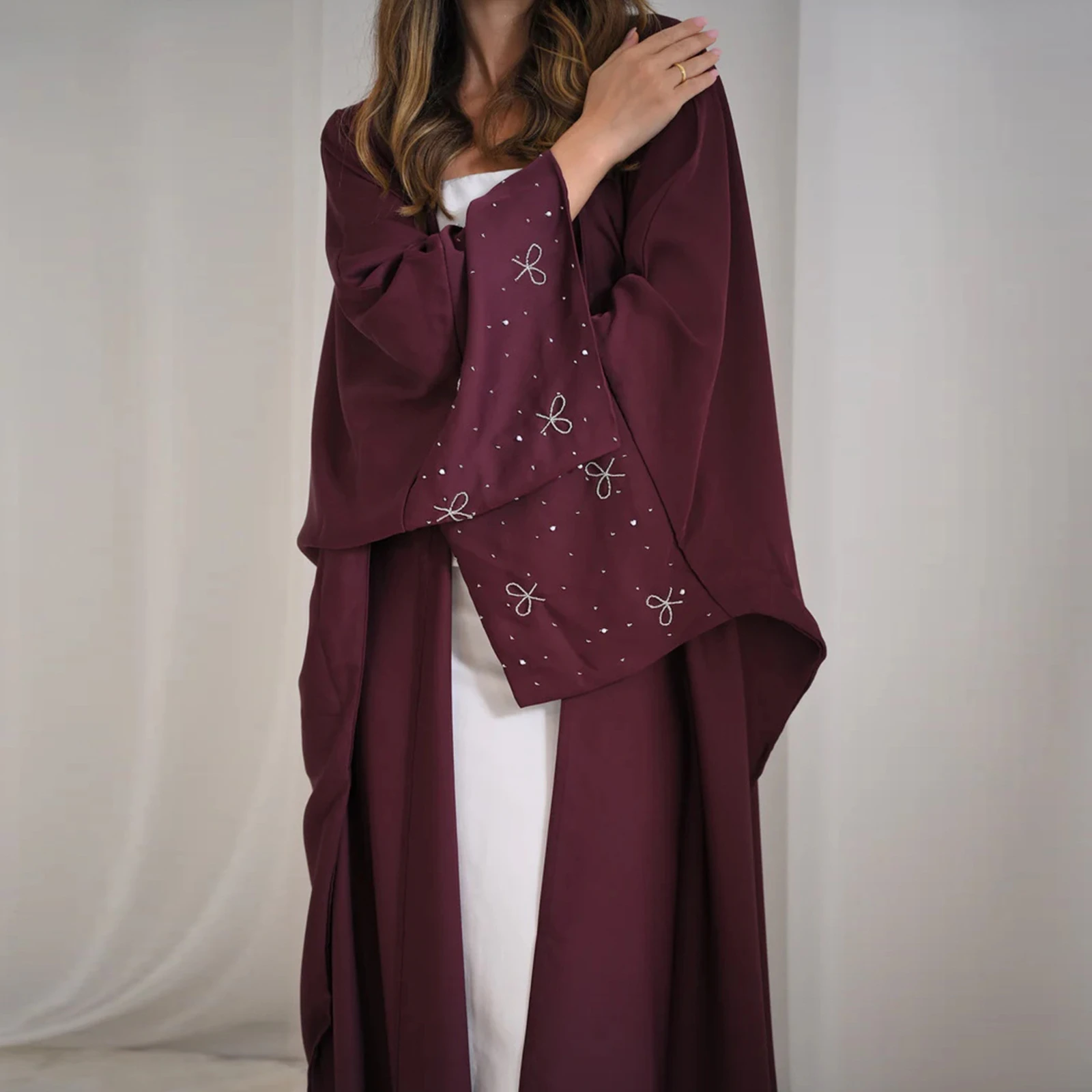 Dubai luxurious new cloak for Muslim women, decorated with beads and bow, in a solid color, elegant Arabic cardigan for Ramadan and Eid
