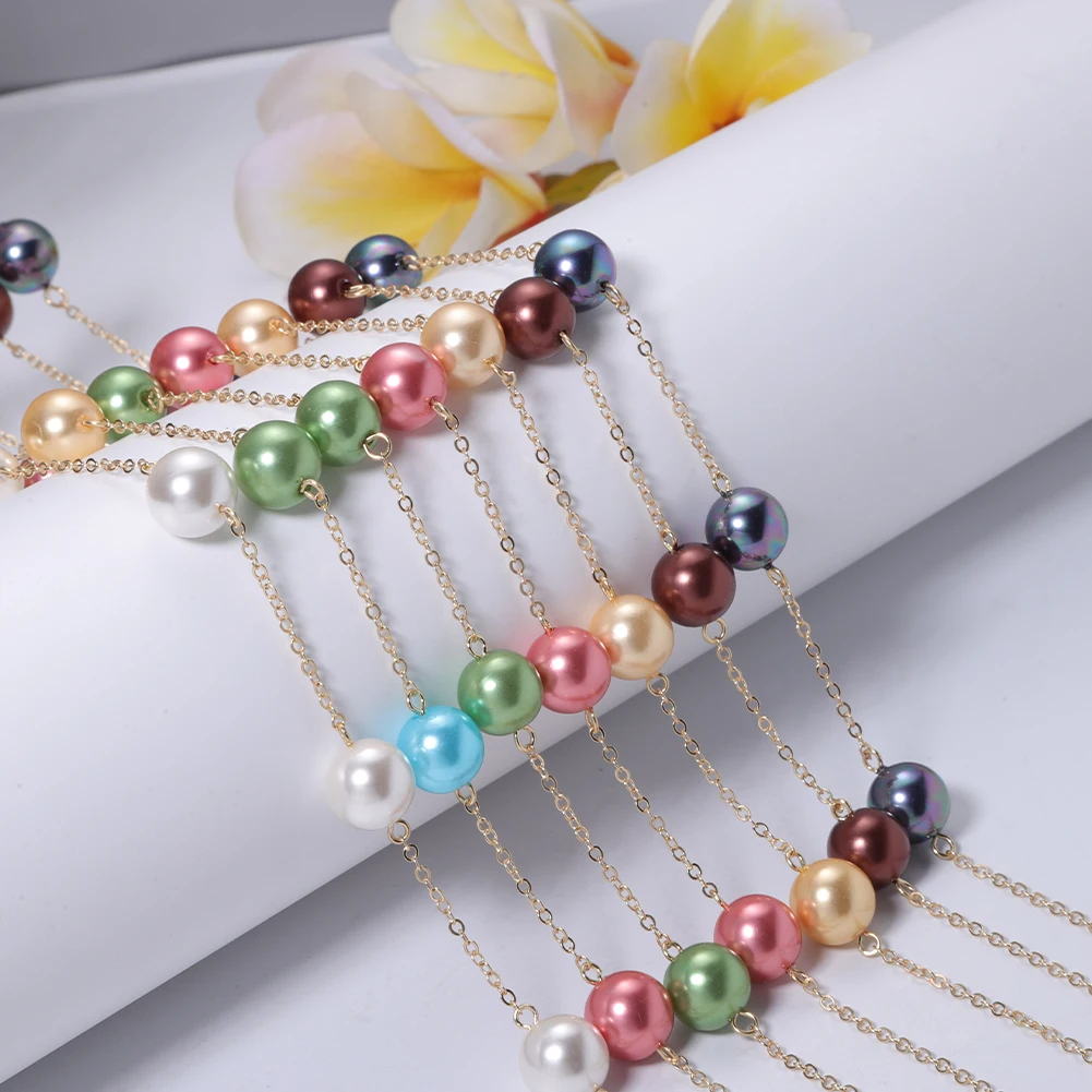 Sold at Auction: A Multi-Coloured South Sea Pearl Shell Bead Necklace. 12mm  beads. 44cm length. Heart clasp.