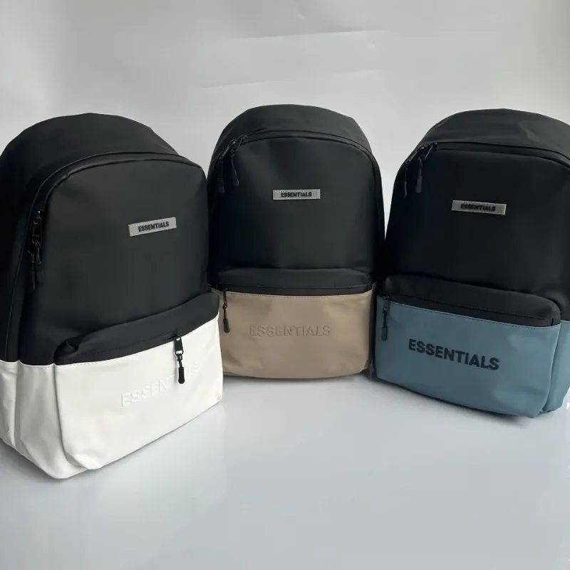 

ESSENTIALS Trendy brand new leather patchwork color backpack with embossed printed letters PU backpack large capacity backpack