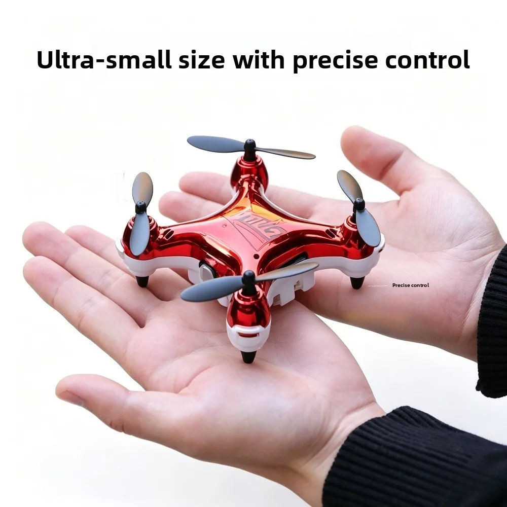 Drone pour débutant avec caméra HD posé sur une surface, montrant ses hélices et son design pliable.