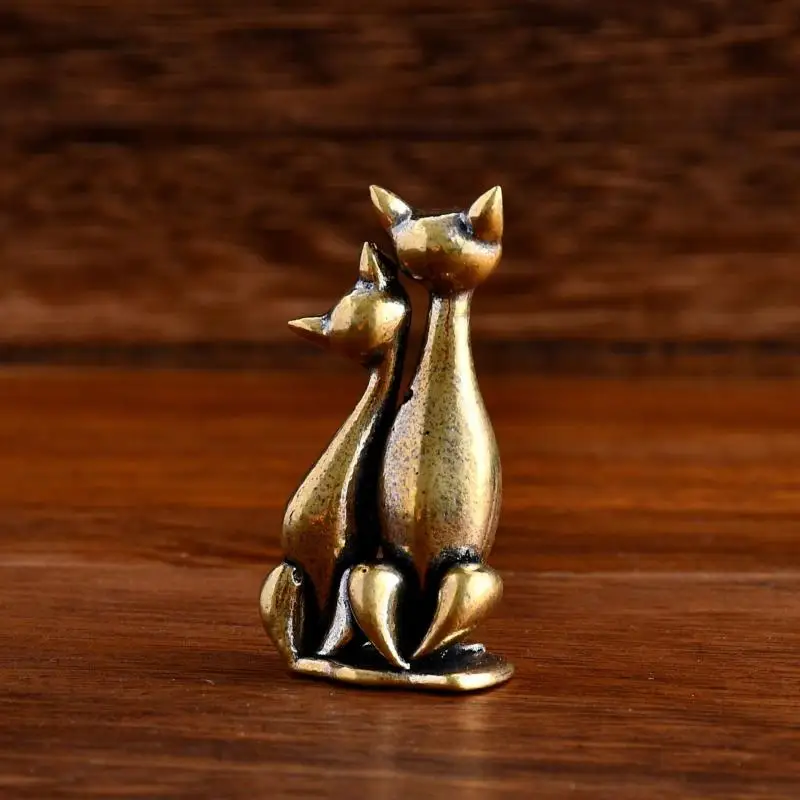 KittyNook Cat Co.’s Intertwined Loving Cats Brass Sculpture—meaningful decor of a cat couple sitting together.