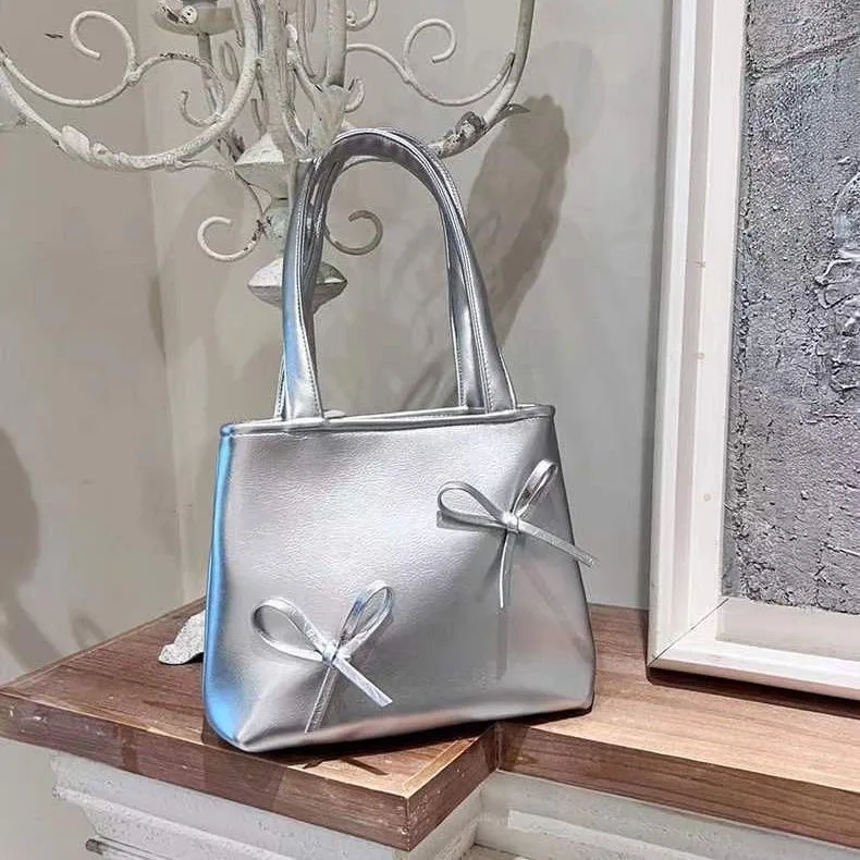 

2023 Y2k Women's Handbags Premium Silver Unique Design Niche style Bow Mini Small Girl Cool Sweet PU Shoulder bag High quality