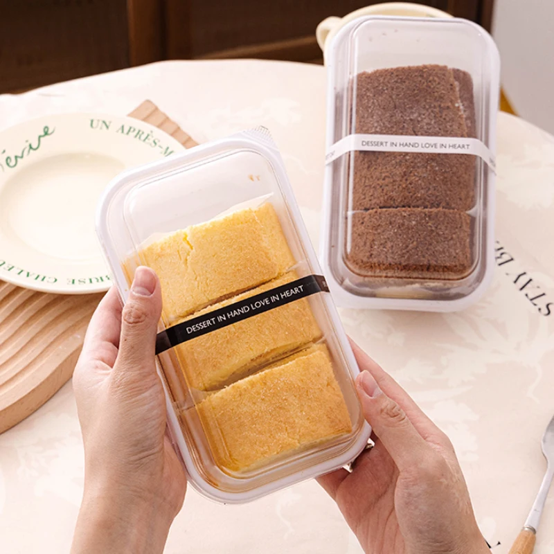 https://ae01.alicdn.com/kf/S922a8f1d98d74e95807c2e803ac391b0R/50Pack-Roll-Cake-Box-Hot-Dog-Sandwich-with-Clear-Lid-Plastic-Container-for-Home-Party-Christmas.jpg