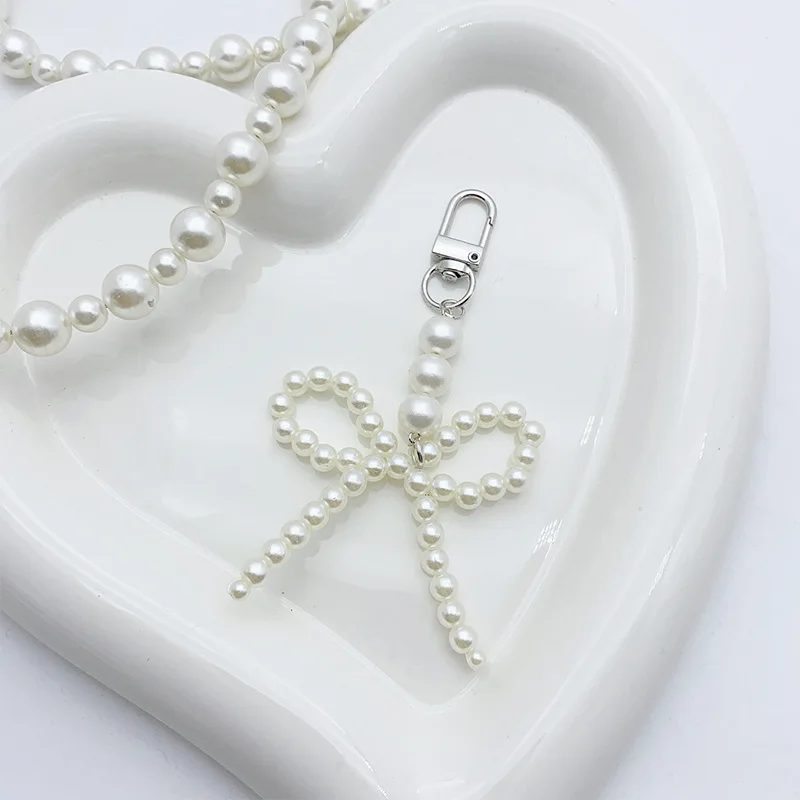 

Простой брелок с имитацией жемчуга и бантом, брелок с милым бантом и жемчугом, подвеска для женского рюкзака, шарм, аксессуары