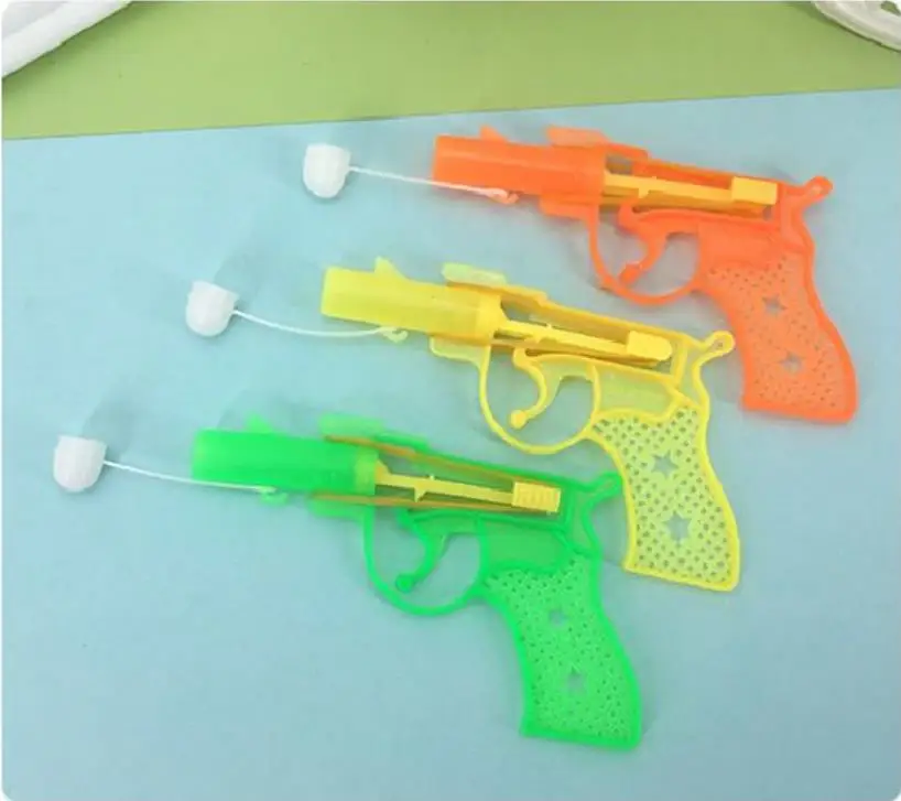 1 PCS 2023 Novelty Rubber Band Hand Pull Dong Dong Punch Empty Gun Gifts Punch Paper Ball Gun Christmas Toys For Children Funny 3