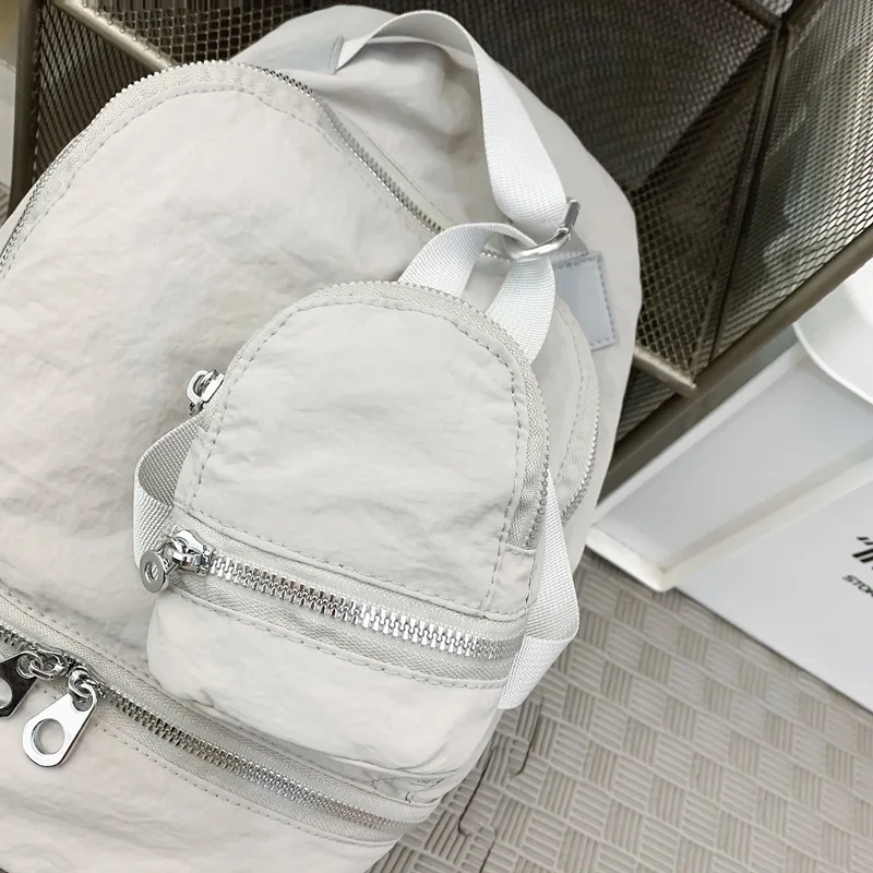 캐주얼 미니 미니 어깨 배낭 동전 지갑 키 체인 펜던트 나일론 휴대용 지퍼 메이크업 가방 여성 키 가방 헤드폰 가방